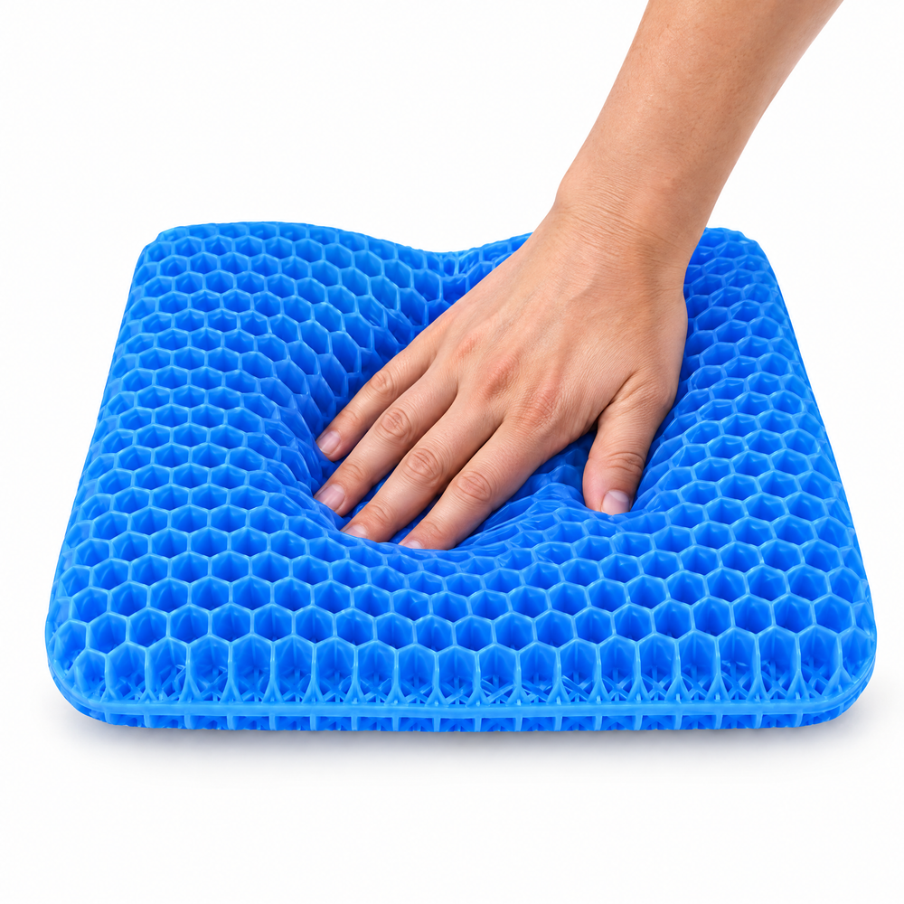 A hand pressing into the RejuvaSeat honeycomb gel, which gives under the pressure